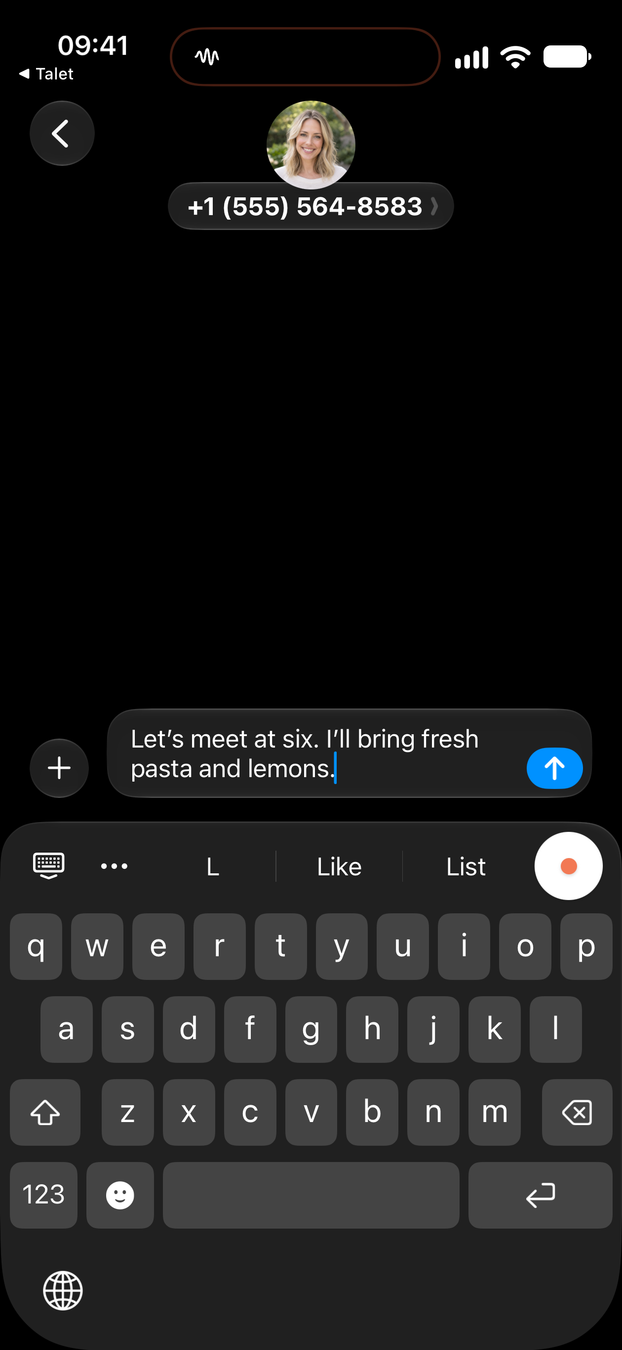 Close-up of a message draft and the Talet keyboard, with its orange voice button.